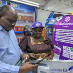 A man at a PalmPay agent booth