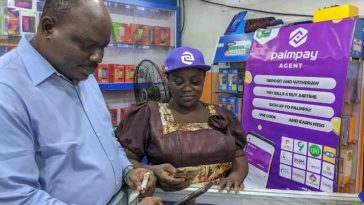 A man at a PalmPay agent booth