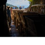 Carts of mineral ore are hauled out of a mine run by Rutongo Mines Ltd., north of Kigali, Rwanda. A team from Intel's Responsible Minerals Program, as well as representatives of other tech firms, visited mineral-rich Rwanda in November 2019 as part of an industry effort to ensure a legal and ethical supply chain. Tin, tanatalum, tungsten and gold mined in the Central African country are key components of silicon chips that run today's smartphones, laptops, servers and other high-tech gear. (Credit: Walden Kirsch/Intel Corporation)