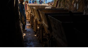 Carts of mineral ore are hauled out of a mine run by Rutongo Mines Ltd., north of Kigali, Rwanda. A team from Intel's Responsible Minerals Program, as well as representatives of other tech firms, visited mineral-rich Rwanda in November 2019 as part of an industry effort to ensure a legal and ethical supply chain. Tin, tanatalum, tungsten and gold mined in the Central African country are key components of silicon chips that run today's smartphones, laptops, servers and other high-tech gear. (Credit: Walden Kirsch/Intel Corporation)