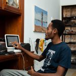 Shoemaker in Accra, Ghana, completes payment